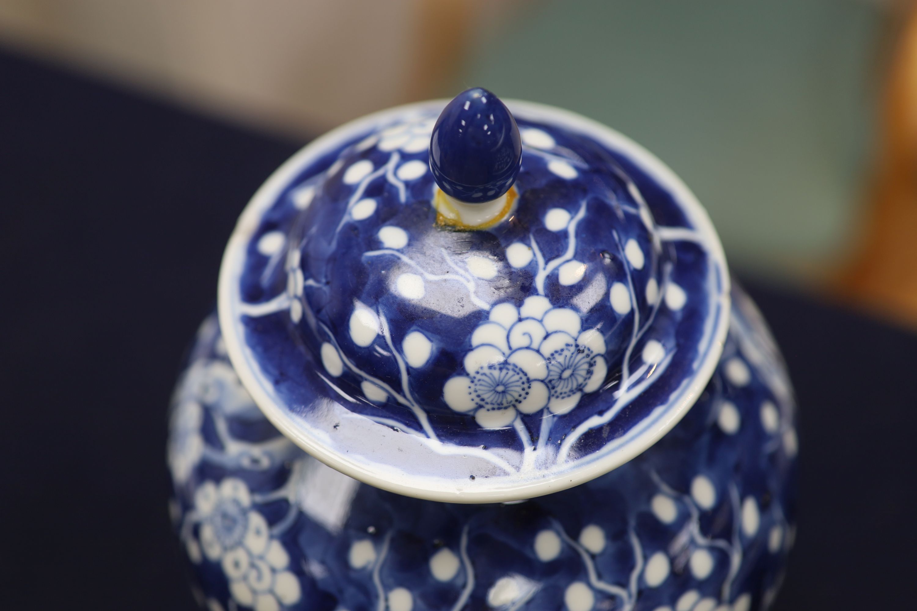 A 20th century Chinese blue and white jar and cover with prunus decoration, height 25cm